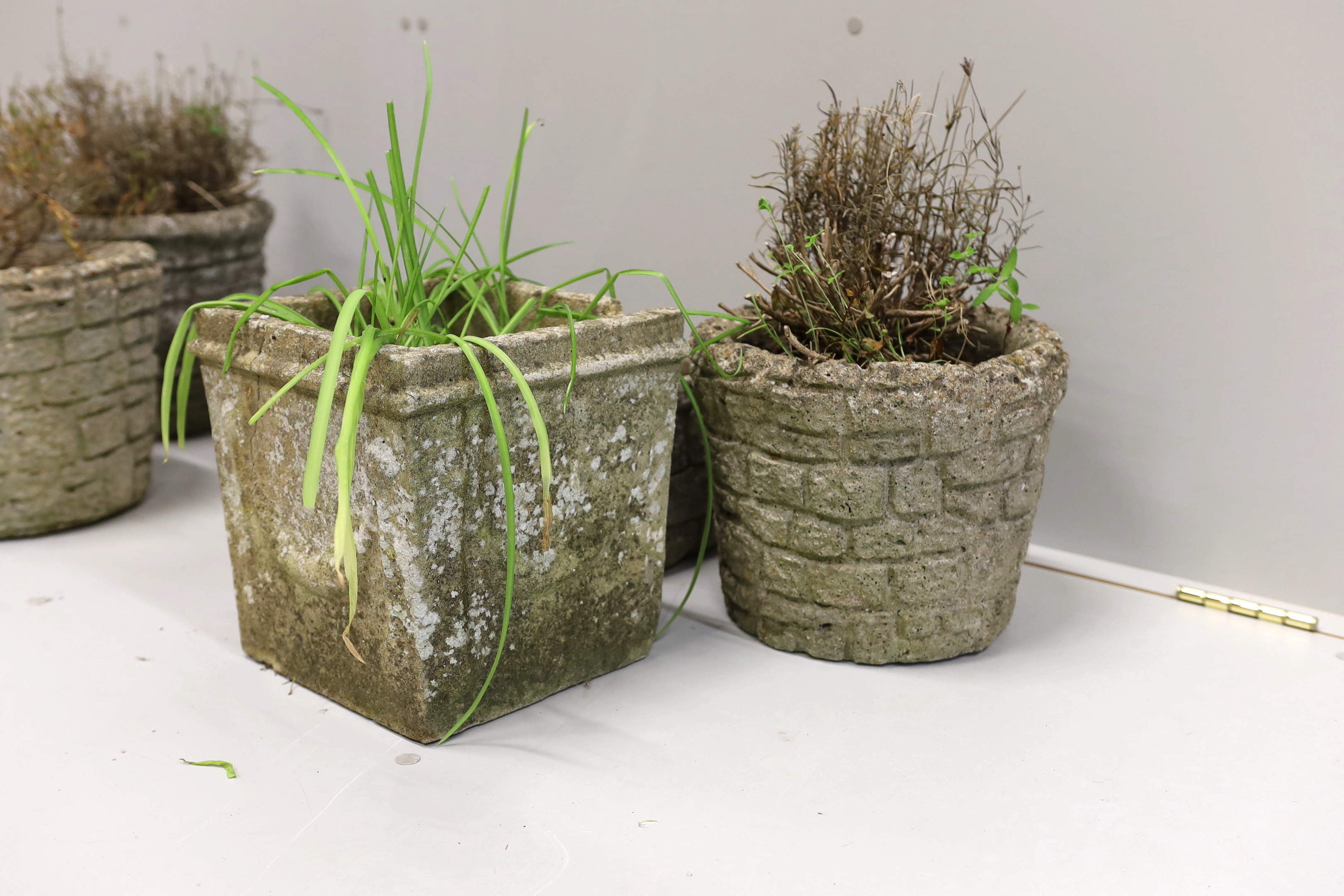 Five reconstituted stone garden planters